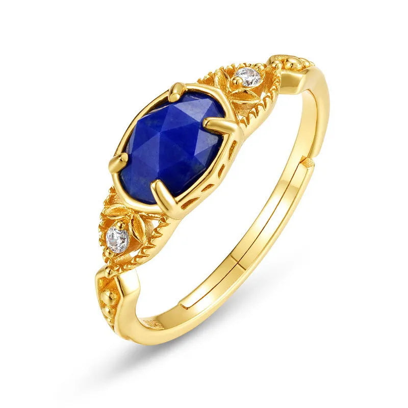 Elliptical silver alloy ring with a natural blue lapis lazuli gemstone for women.