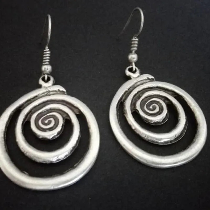Retro geometric spiral earrings with distressed silver finish measuring 2.6cm by 5cm