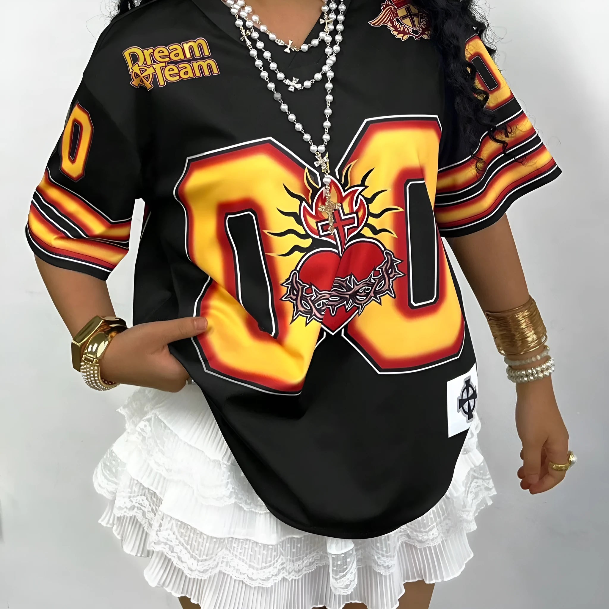 A woman wearing a loose-fit V-neck T-shirt with bold letter printing on the front, showcasing the casual style.