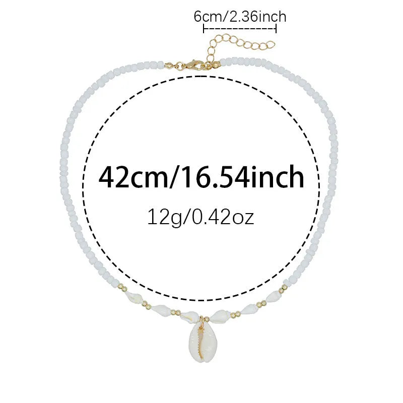 White electroplated conch shell pendant necklace on a regular chain for women.
