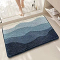 Square rainbow print floor mat with sky and sea colours on a flat, light-coloured polyester fibre pile.