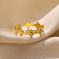Geometric titanium steel women's ring with diamond-cut pattern in gold colour