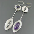 Simple geometric Bohemian earrings in antique silver colour with alloy construction and crystal gemstone detail