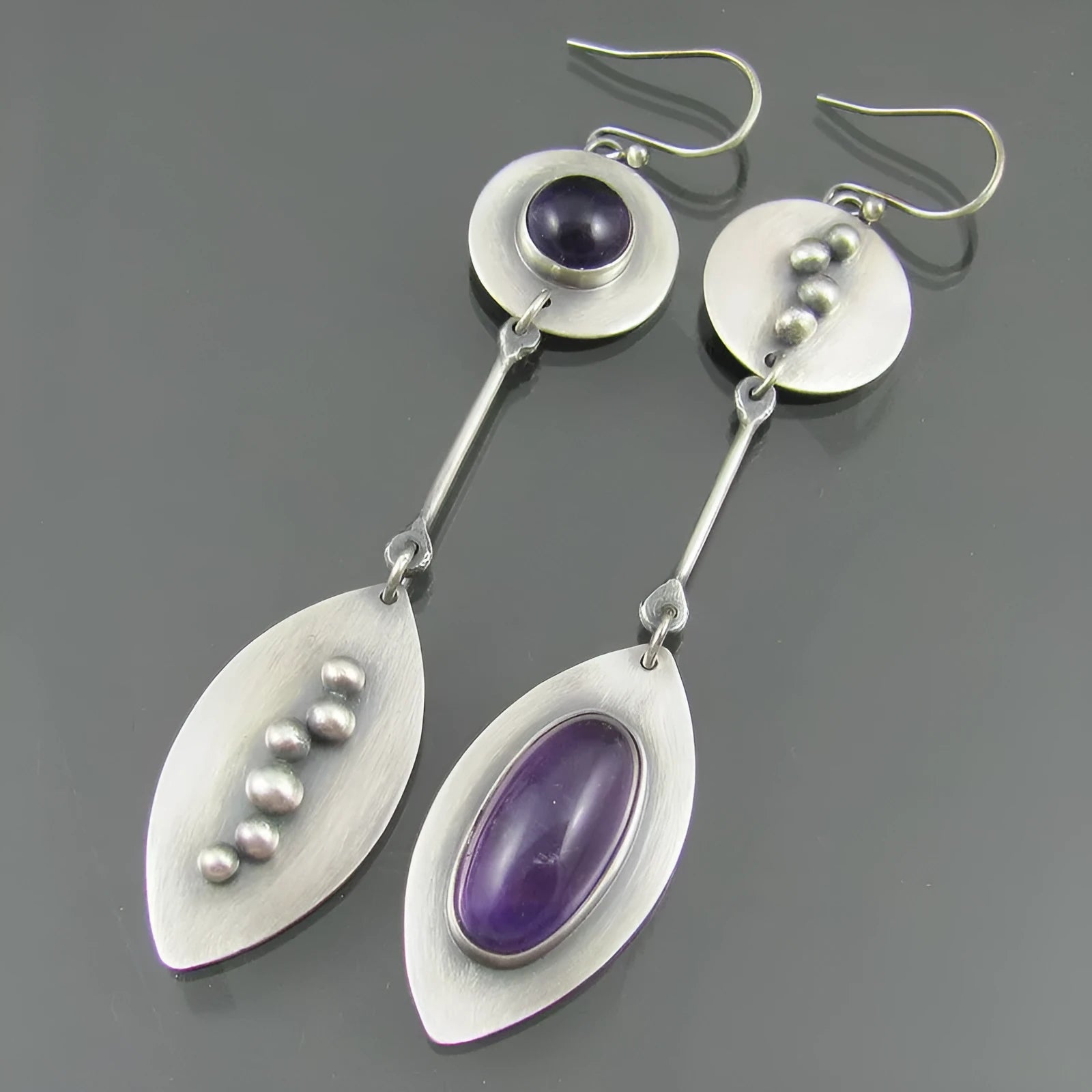 Simple geometric Bohemian earrings in antique silver colour with alloy construction and crystal gemstone detail