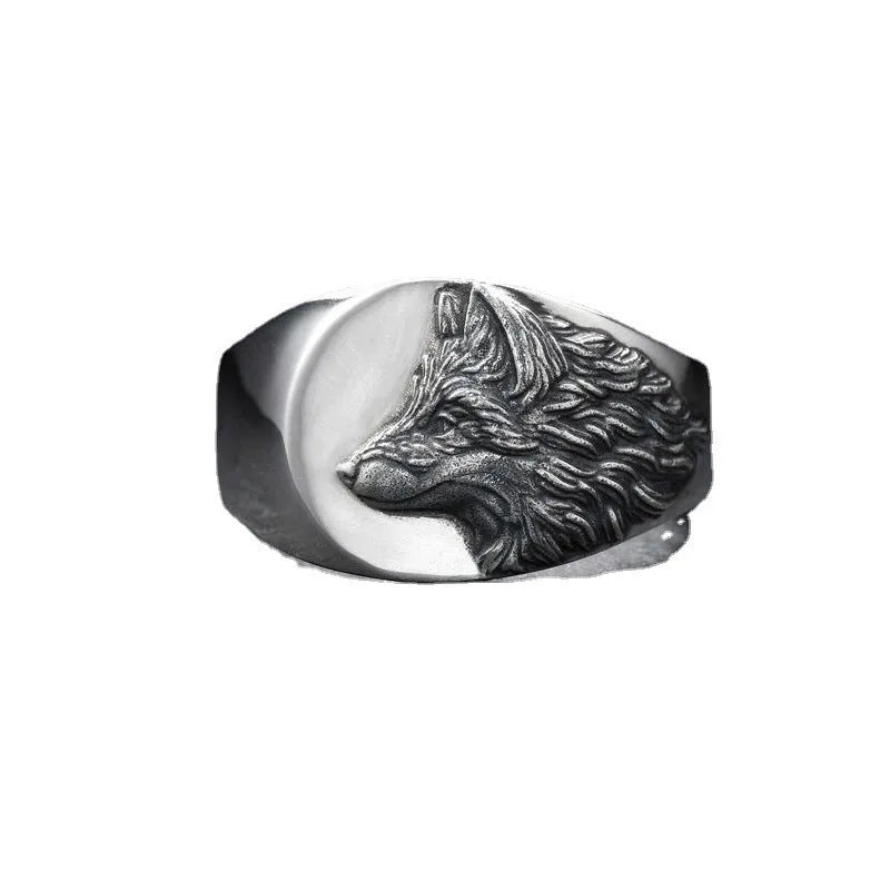 Men's silver alloy ring featuring a detailed geometric wolf design on a dark background.