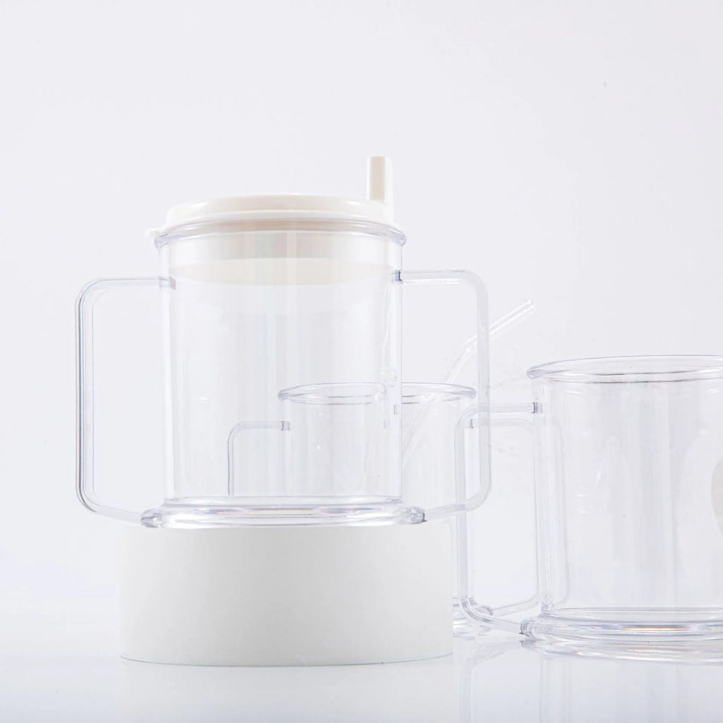 Transparent spill-proof lightweight plastic drinking cup on a table.