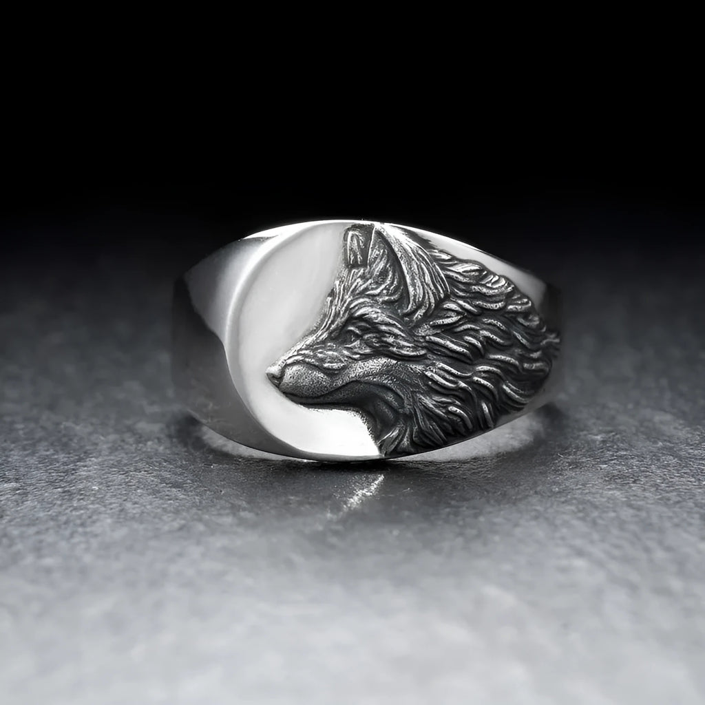 Men's silver alloy ring featuring a detailed geometric wolf design on a dark background.