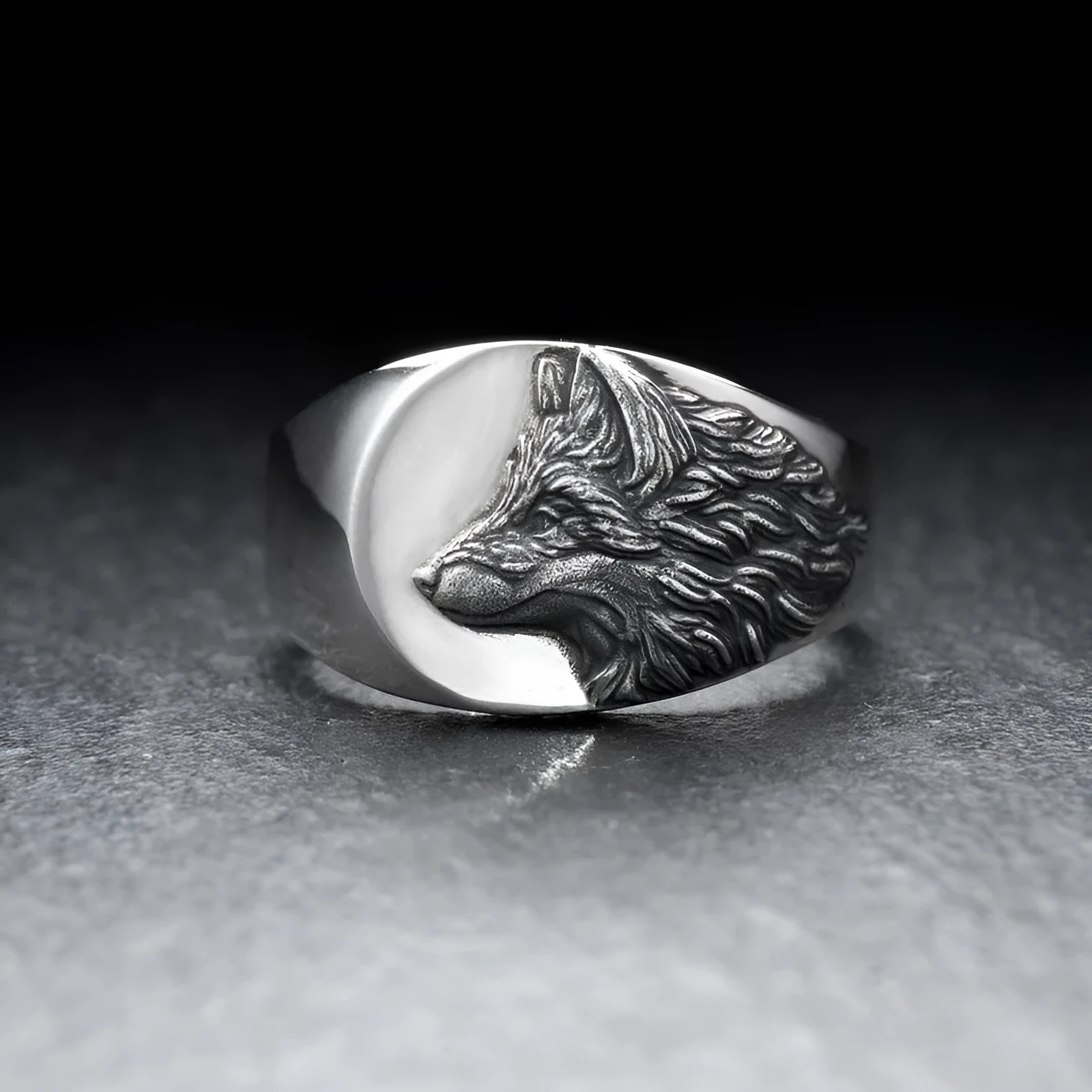Men's silver alloy ring featuring a detailed geometric wolf design on a dark background.