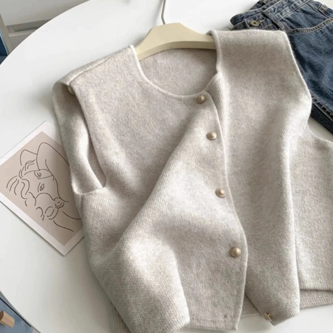Women's thin grey polyester pullover vest with half sleeves, shown as a casual layering piece.