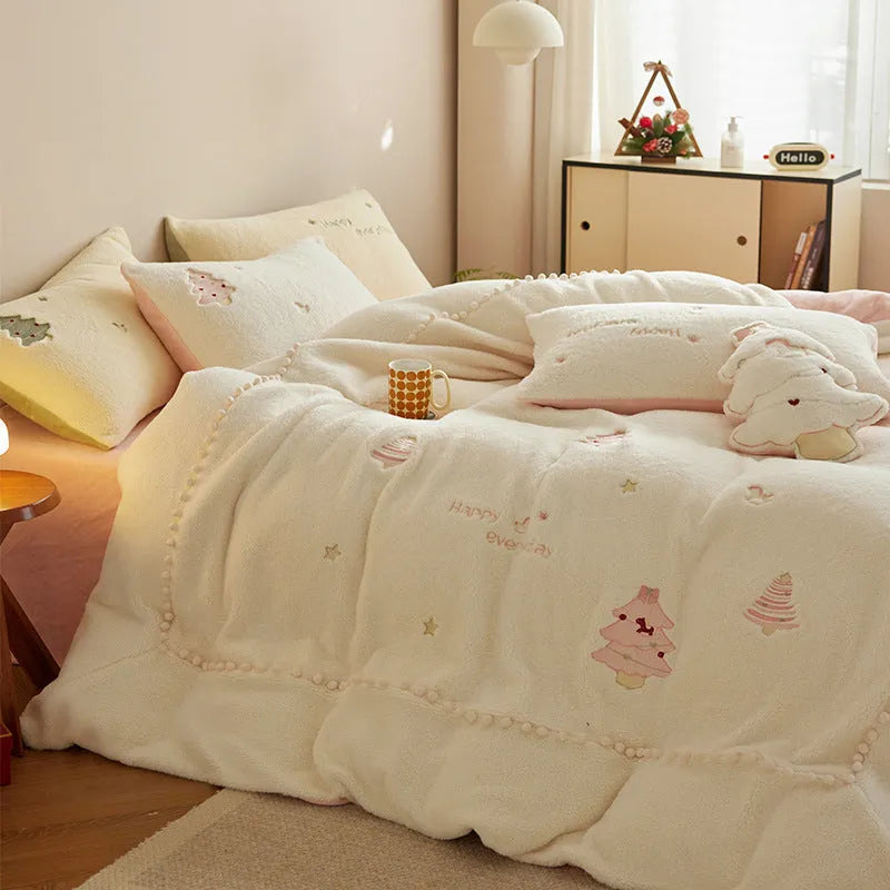Milk fibre four-piece bedding set with green and pink Christmas tree designs on quilt cover and pillowcases.