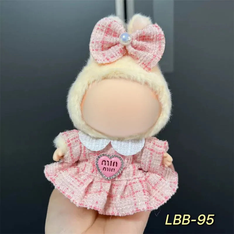 Plastic doll clothes for a 17cm tall vinyl figure on a white background.
