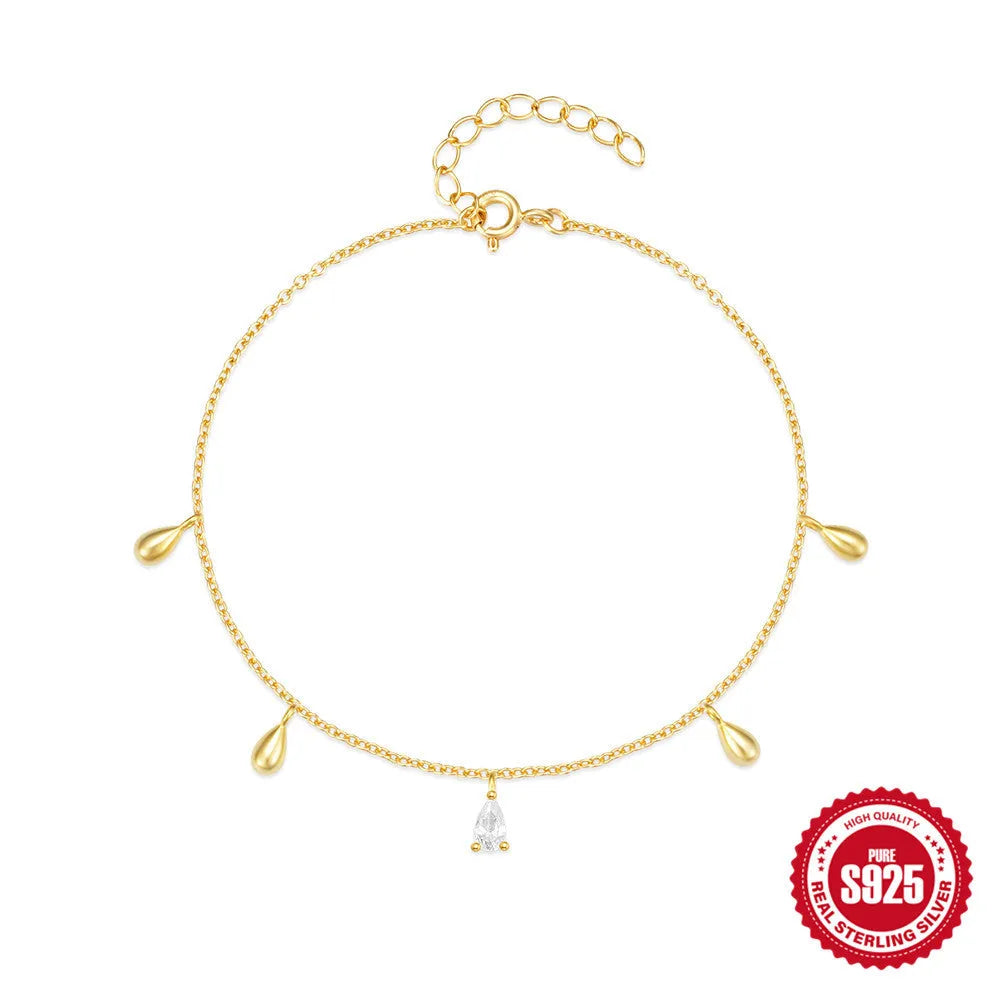 Gold tone S925 sterling silver bracelet with a geometric water drop diamond pendant charm.