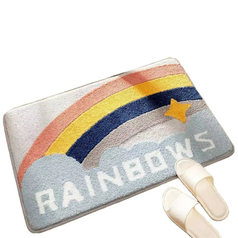 Square rainbow print floor mat with sky and sea colours on a flat, light-coloured polyester fibre pile.