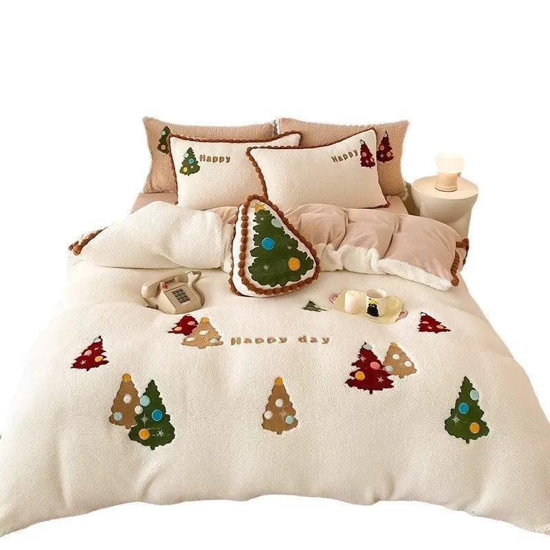 Bright yellow and white Christmas tree fleece bedding set with embroidery on a bed.