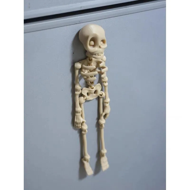 A tall 3D printed white skull refrigerator magnet for Halloween decoration.