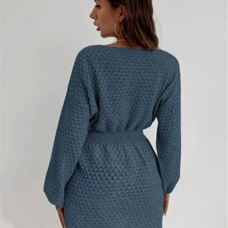 Blue women's knitted dress with hand-crocheted flowers, fitted waist, and 65cm length