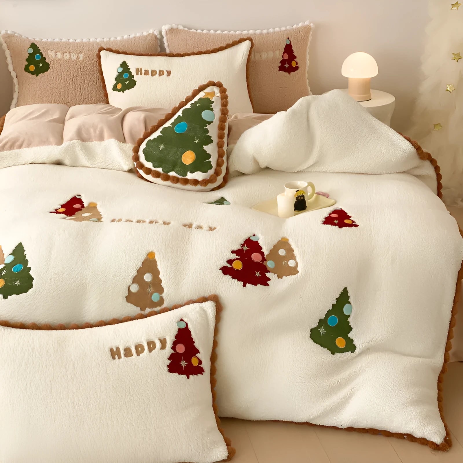 Bright yellow and white Christmas tree fleece bedding set with embroidery on a bed.