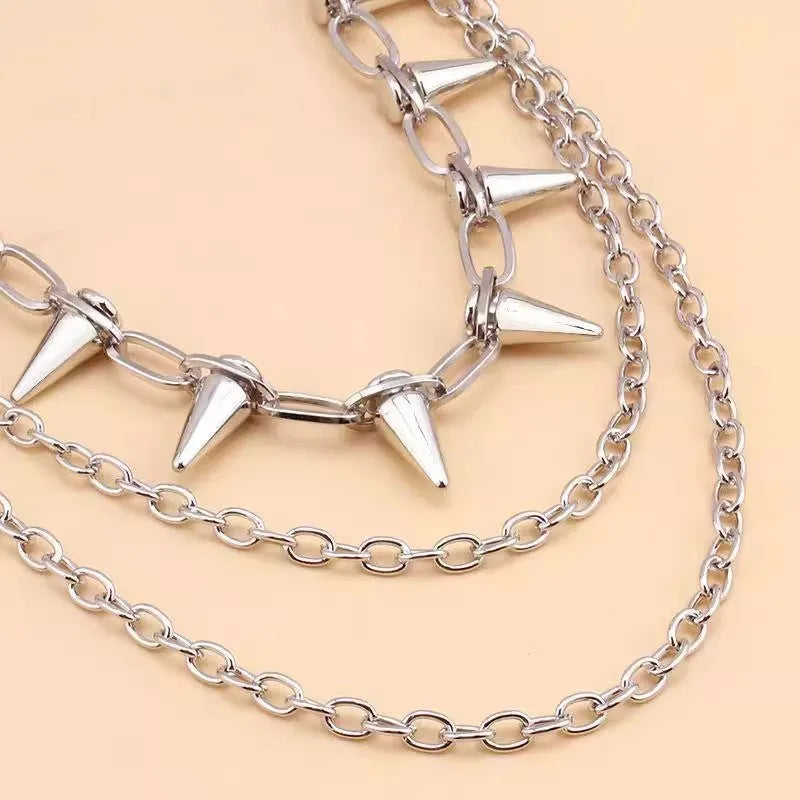 Silver metal alloy punk chain belt with double layers and rivet details, shown at 115cm length.