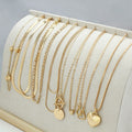 Ten gold electroplated women's necklaces with alloy pendants on snake bones chains