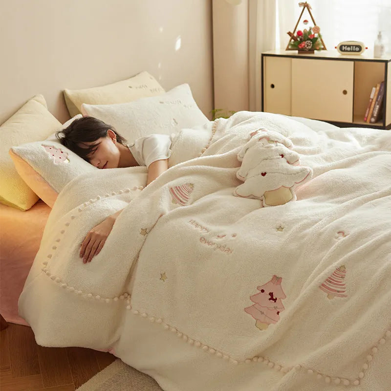 Milk fibre four-piece bedding set with green and pink Christmas tree designs on quilt cover and pillowcases.