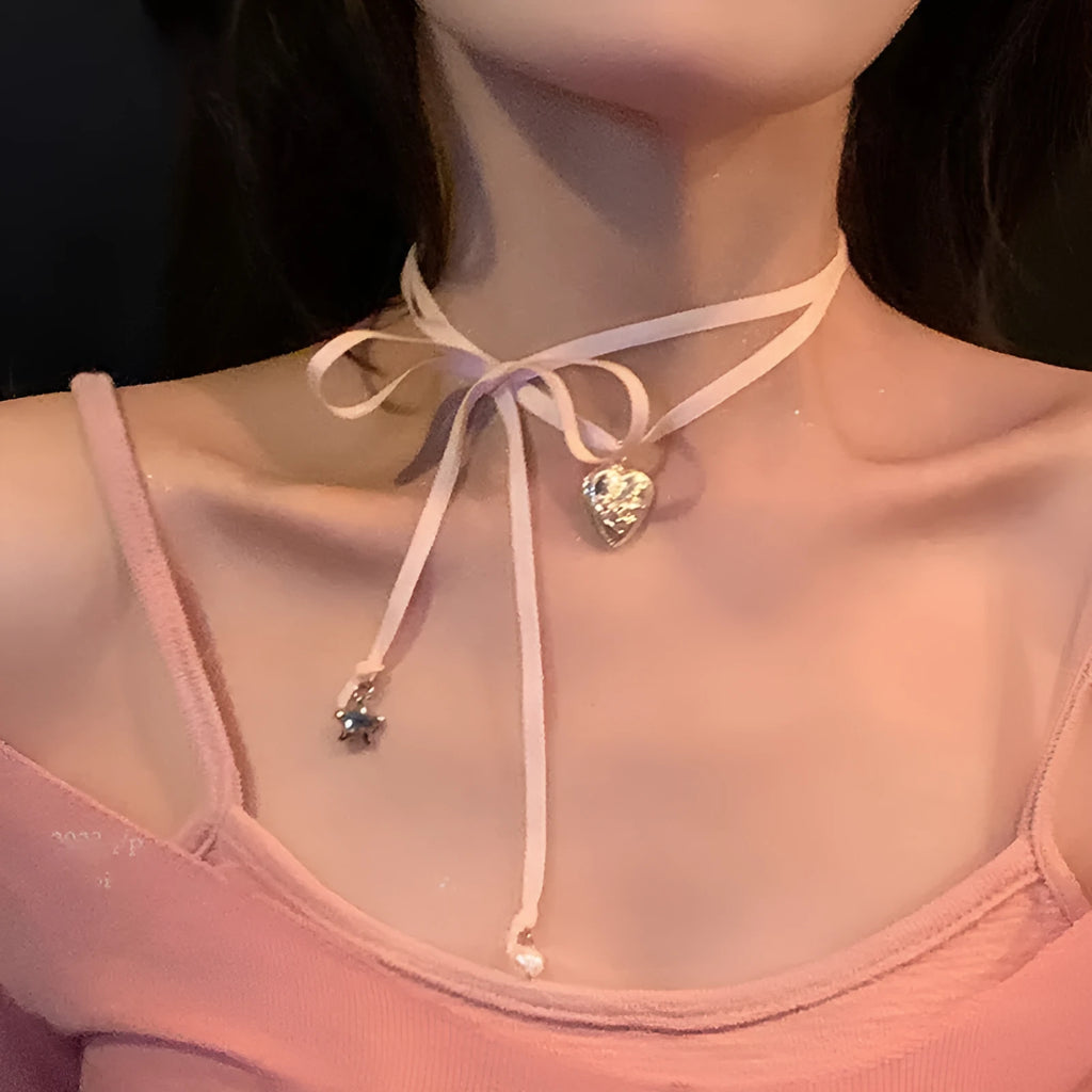Silver-tone women's necklace with a ribbon love pendant on a delicate clavicle chain.