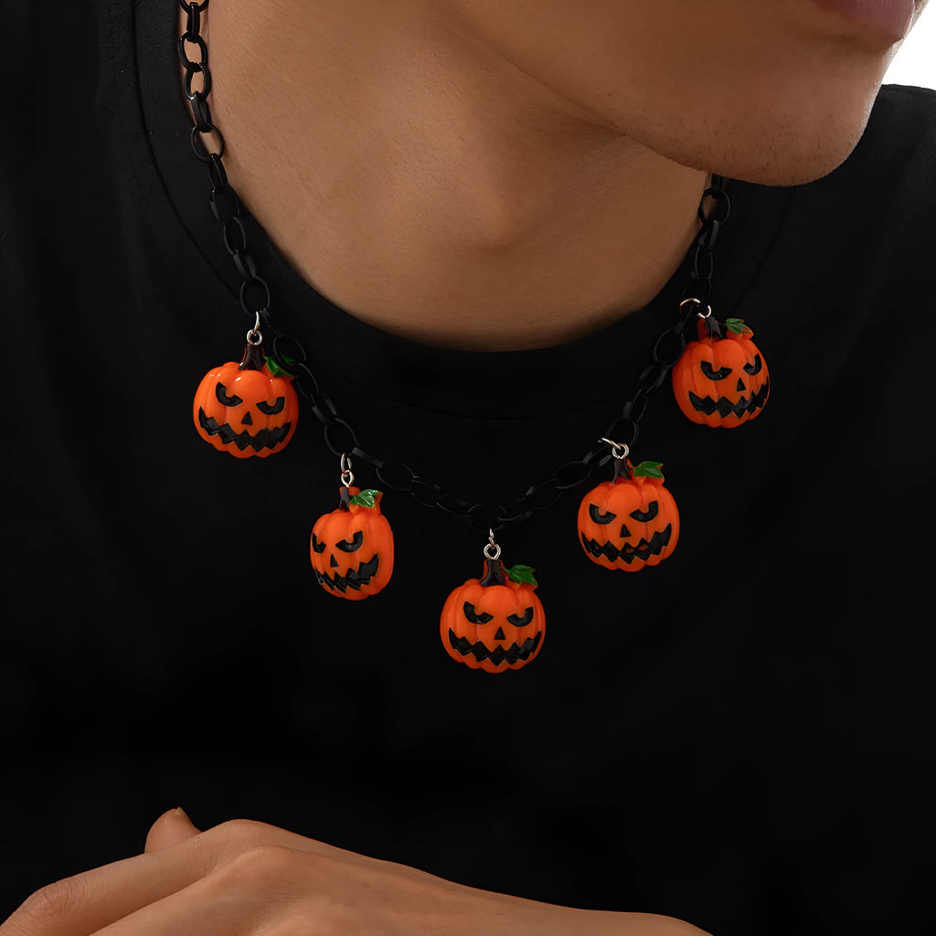 Halloween necklace showing a cartoon ghost and pumpkin acrylic pendant on a chain, colour 06705.