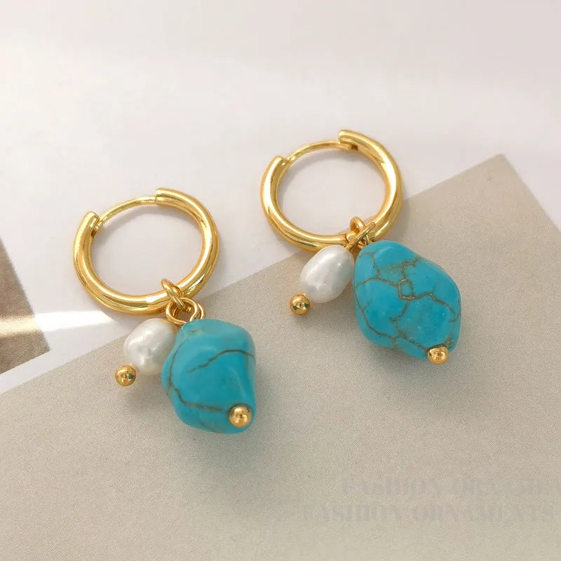A pair of long and a pair of short geometric copper ear clips with turquoise and cultured pearls.
