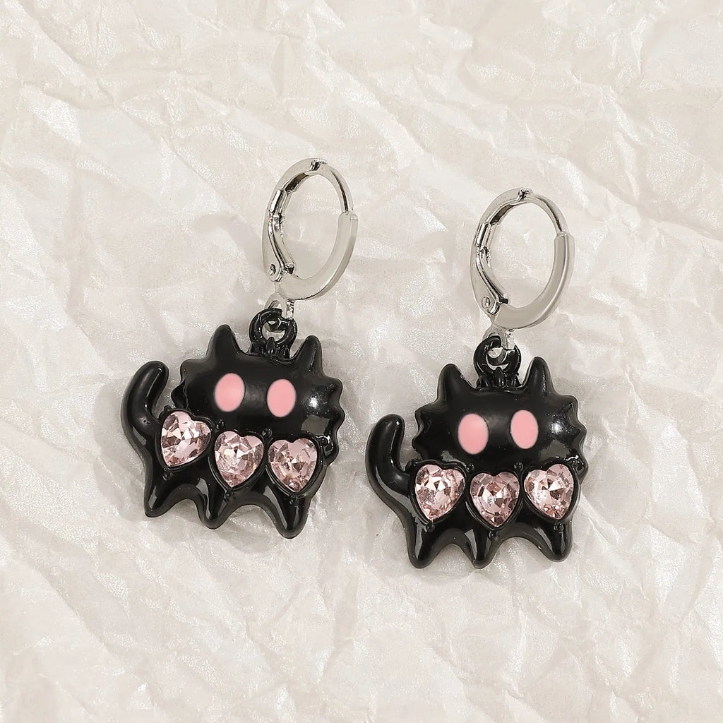 Women's alloy drop earrings showing cross, heart, and animal designs in five colour finishes