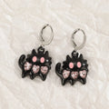 Women's alloy drop earrings showing cross, heart, and animal designs in five colour finishes