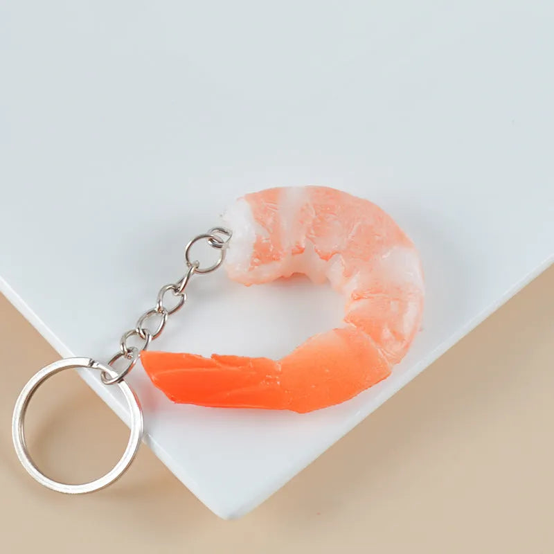 PVC injection moulded shrimp-shaped keychain with door buckle attachment measuring 1.5cm thick