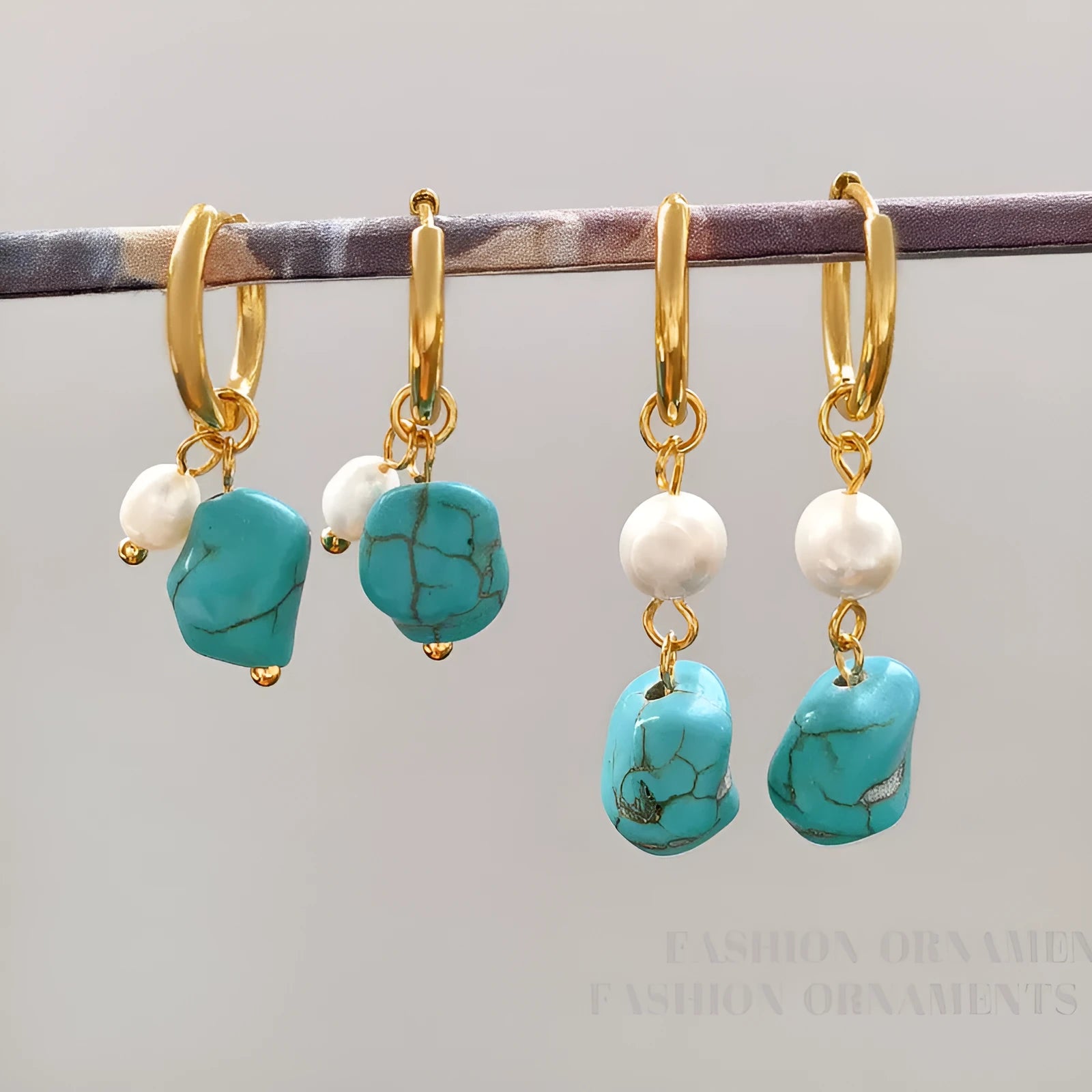A pair of long and a pair of short geometric copper ear clips with turquoise and cultured pearls.