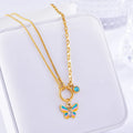 Gold tone epoxy butterfly pendant necklace and bracelet set with snake bone chain.