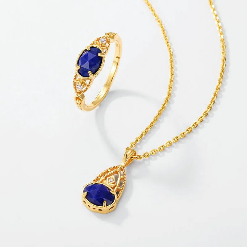 Elliptical silver alloy ring with a natural blue lapis lazuli gemstone for women.