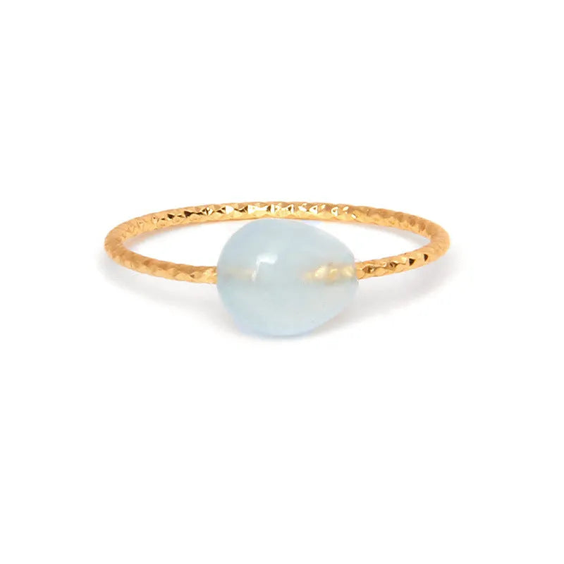 Women's geometric niche design ring with a coloured agate stone centrepiece.