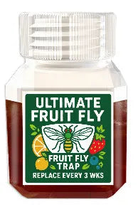 Bottle of SK003 fruit fly bait liquid on a kitchen countertop.