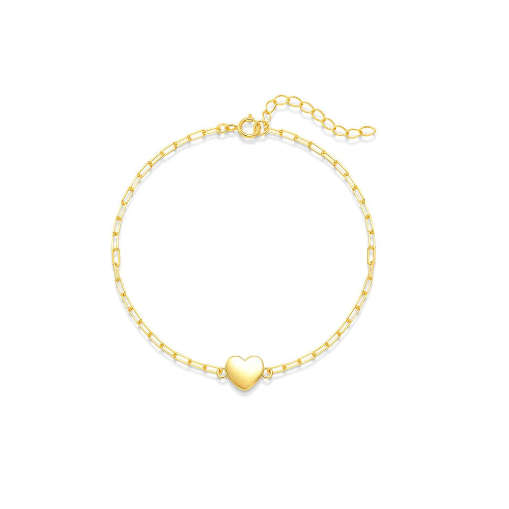 S925 sterling silver women's bracelet with glossy gold tone heart charm and lobster clasp closure