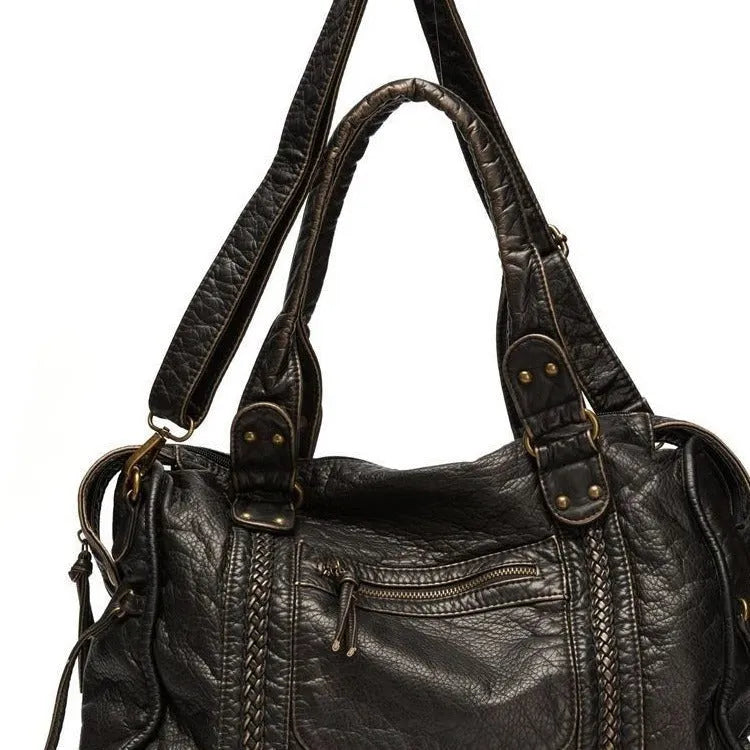 Women's retro motorcycle shoulder messenger bag in brown with weaving design elements and single adjustable strap