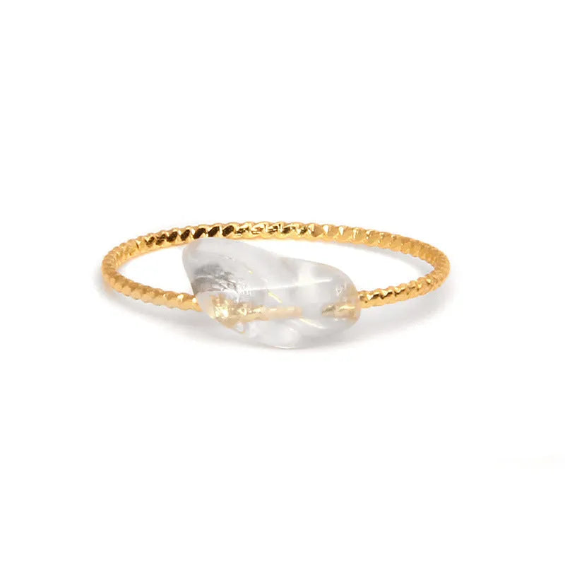 Women's geometric niche design ring with a coloured agate stone centrepiece.