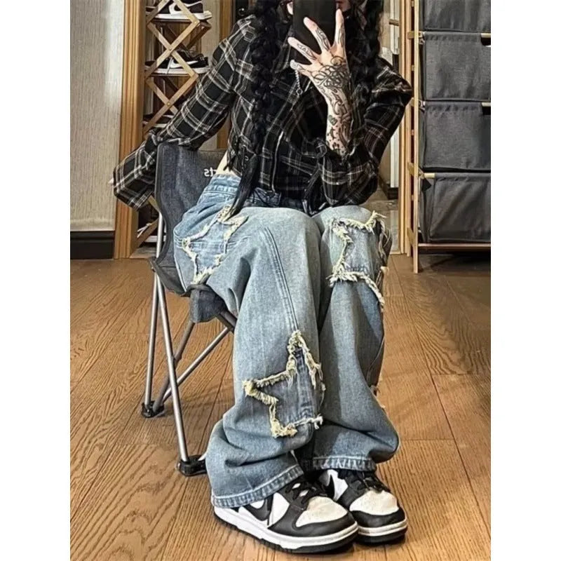 Blue women's high-waist straight-leg jeans on a neutral background.