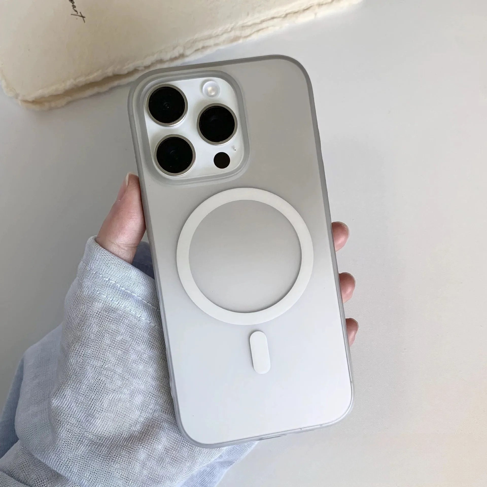 Gradient colour frosted magnetic suction protective case for iPhone on a white background.