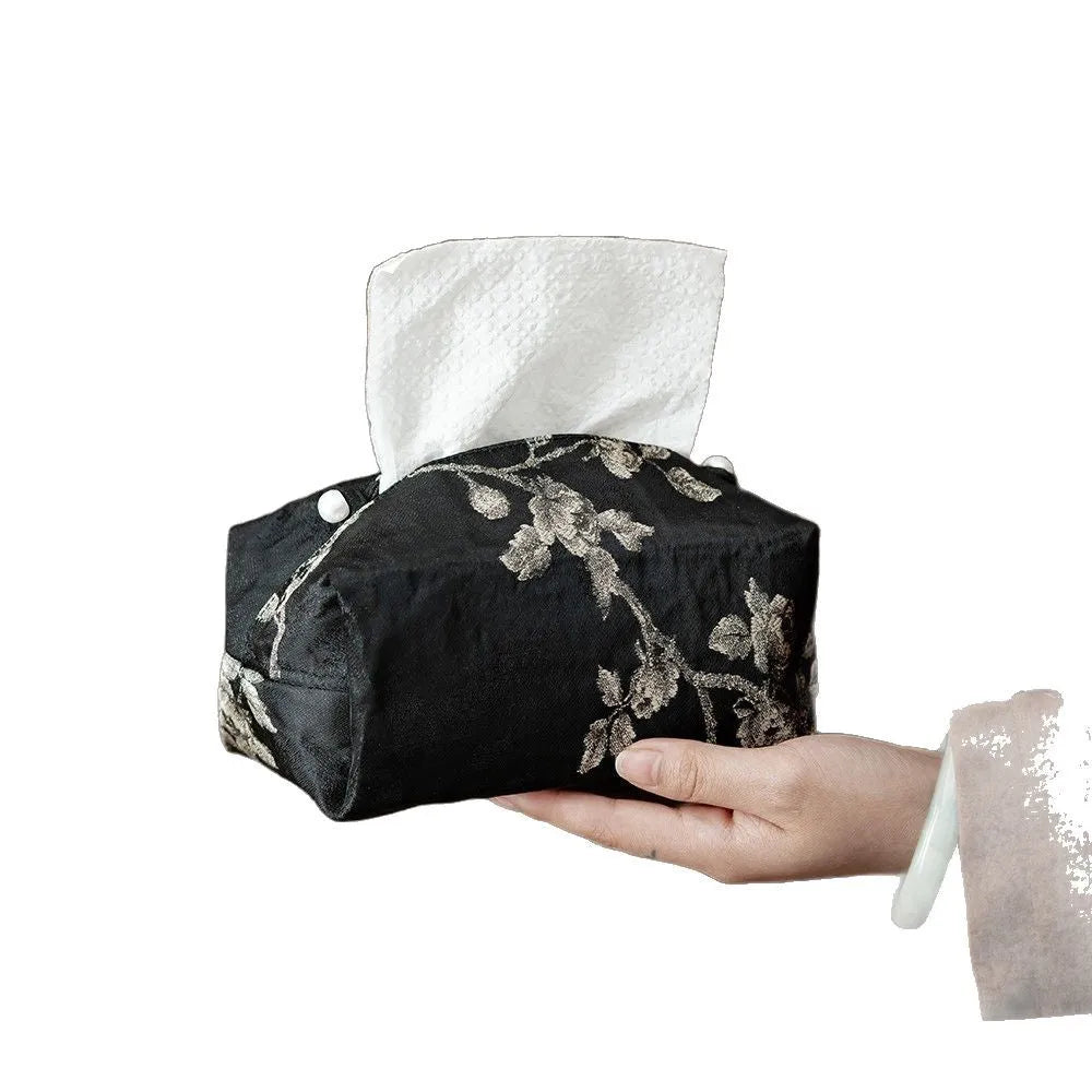 White Chinese brocade tissue box cover with embroidered plum blossoms, showing pearl buckle and plain opening options.