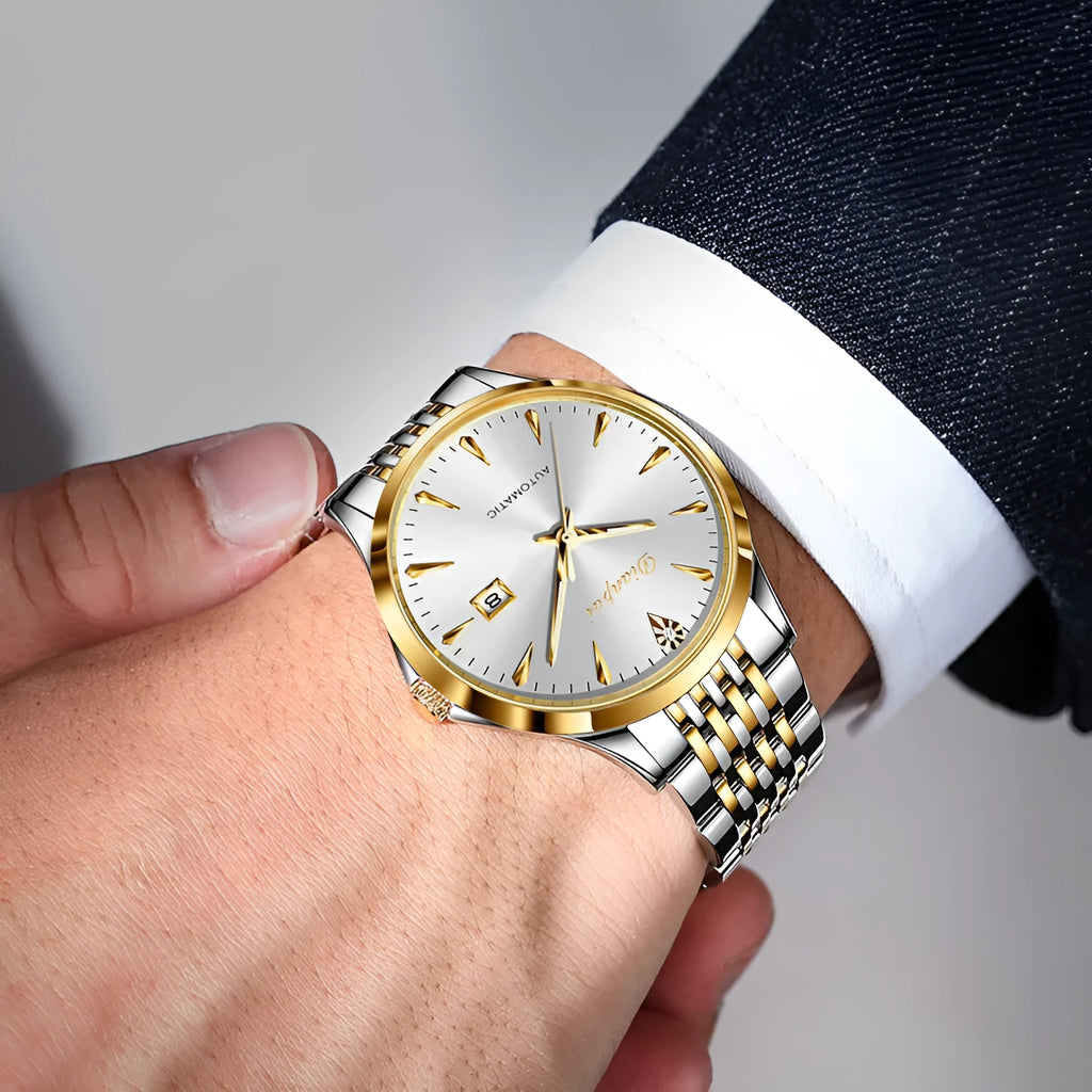 Men's simple dial automatic watch with stainless steel strap on wrist.