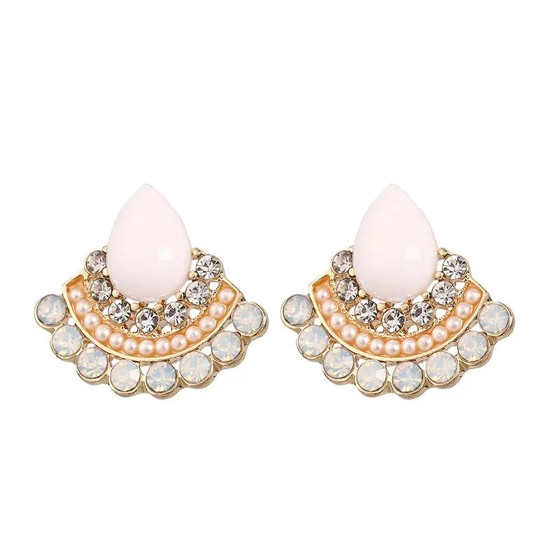 Retro silver geometric fan-shaped drop earrings with rhinestone and opal-style details.