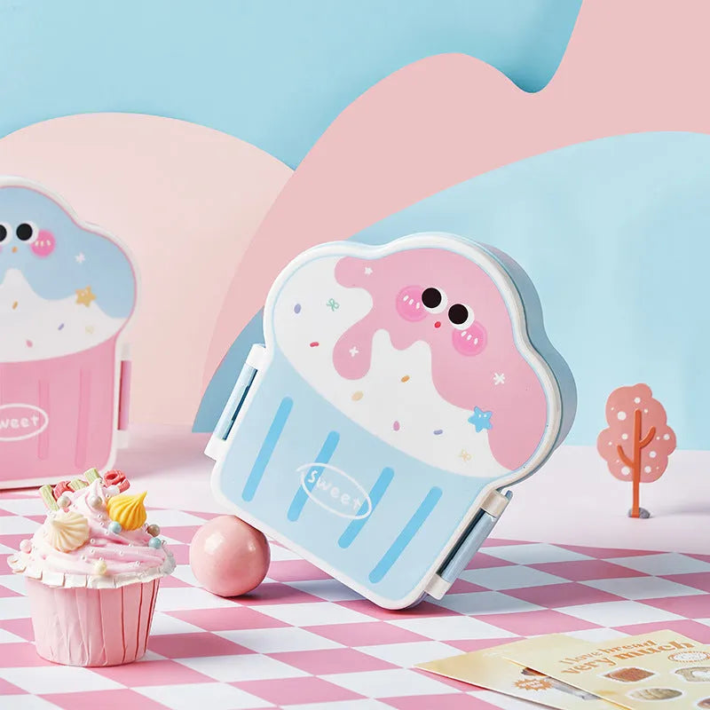 Pink and blue creative ice cream shaped plastic lunch boxes with spoons and forks on a plain background.