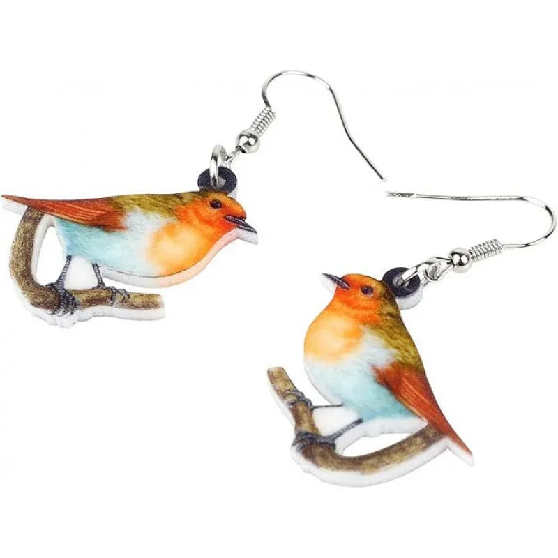 Blue, yellow, and white titmouse bird acrylic pendant drop earrings on a white background.