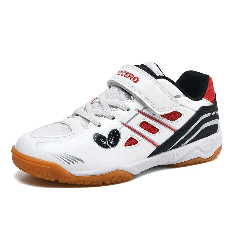 White and blue children's low-top badminton shoes with a ribbed sole on a court surface.