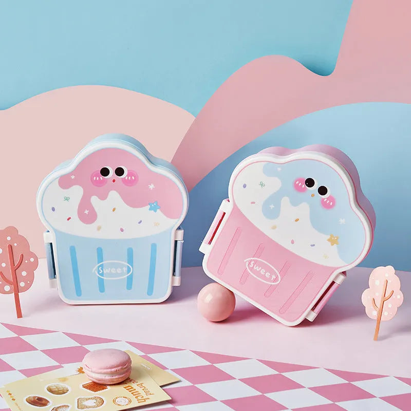 Pink and blue creative ice cream shaped plastic lunch boxes with spoons and forks on a plain background.
