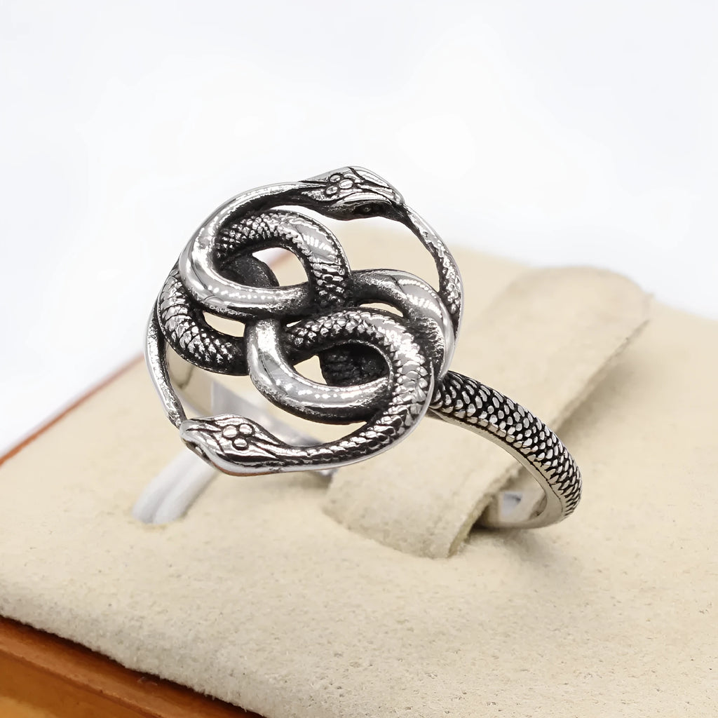 Titanium steel double snake ring in retro style with a steel colour finish, shown on a hand.