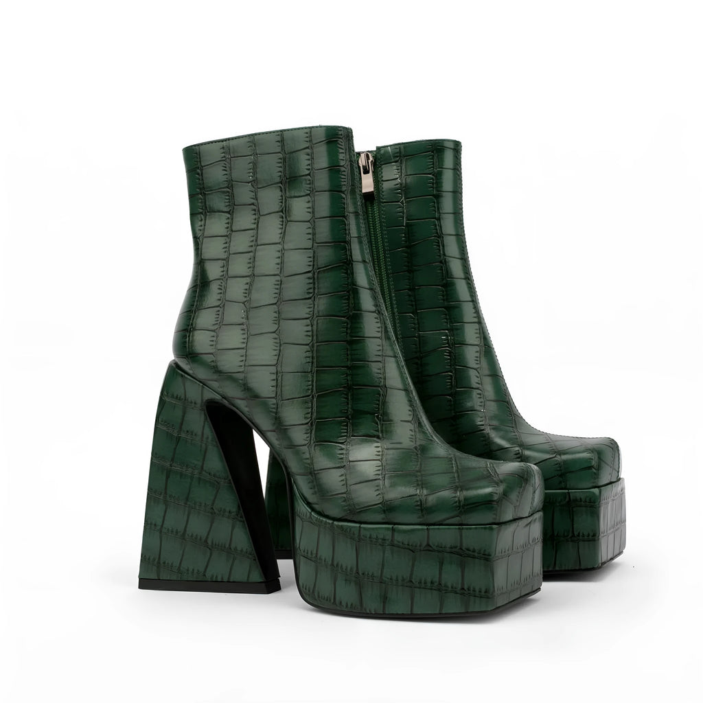 A pair of women's super high heel ankle boots in a solid colour with an artificial PU upper.