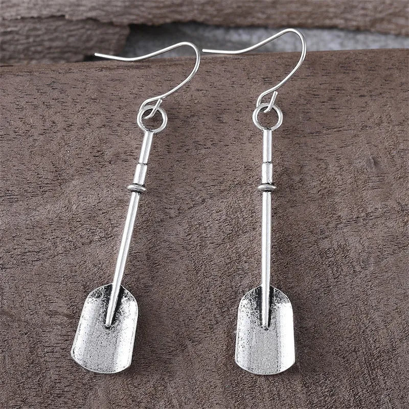 Long antique silver shovel-shaped drop earrings with a geometric retro design.